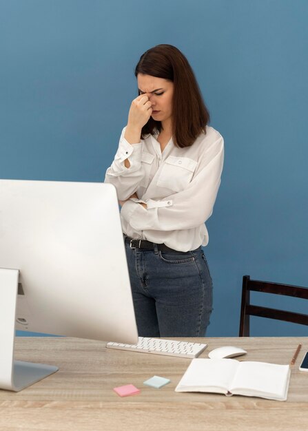 Stressed woman working on computer