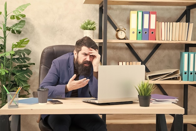 Stressed of work businessman in formal outfit stressed man use laptop Boss work at workplace stressed bearded man work in business office feeling stressed after work Realy busy man