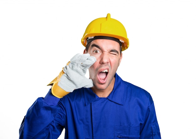 Stressed worker shouting on white background