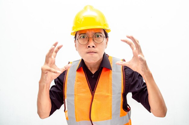 stressed young asian male construction worker or engineer shows expresion of anger and furious.