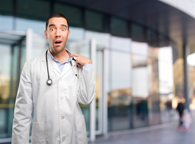 Stressed young doctor with a gesture of ansiety