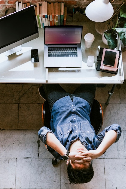 Stressful and tired man sitting by a computer