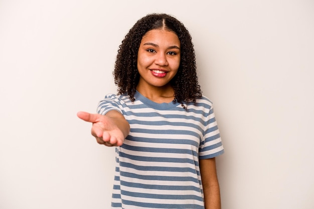 Stretching hand at camera in greeting gesture