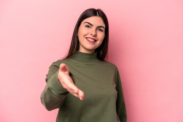 Stretching hand at camera in greeting gesture