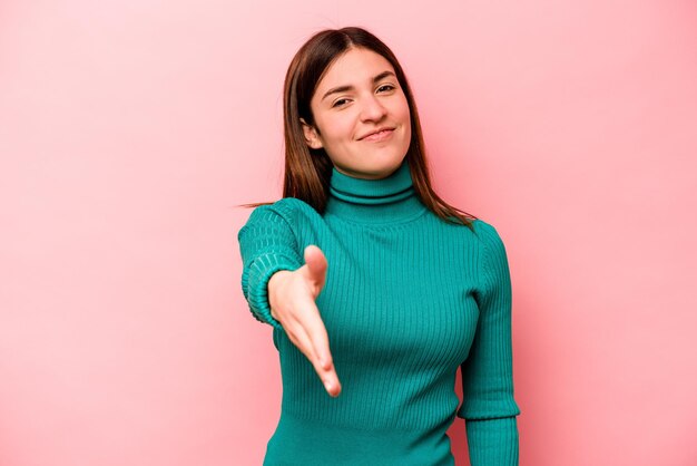 Stretching hand at camera in greeting gesture