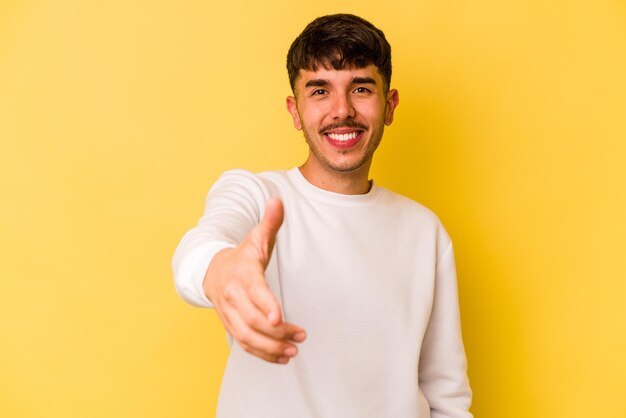 Stretching hand at camera in greeting gesture