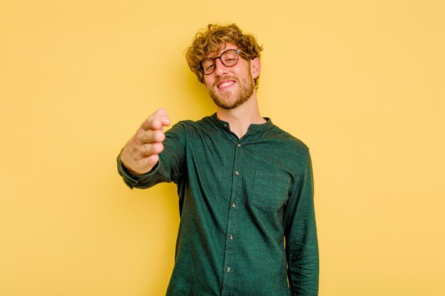 Stretching hand at camera in greeting gesture