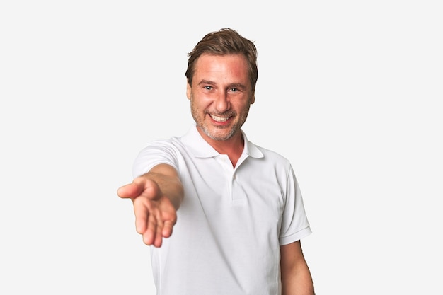 Stretching hand at camera in greeting gesture