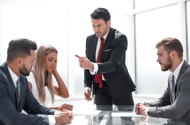 Strict boss at a meeting with the business team