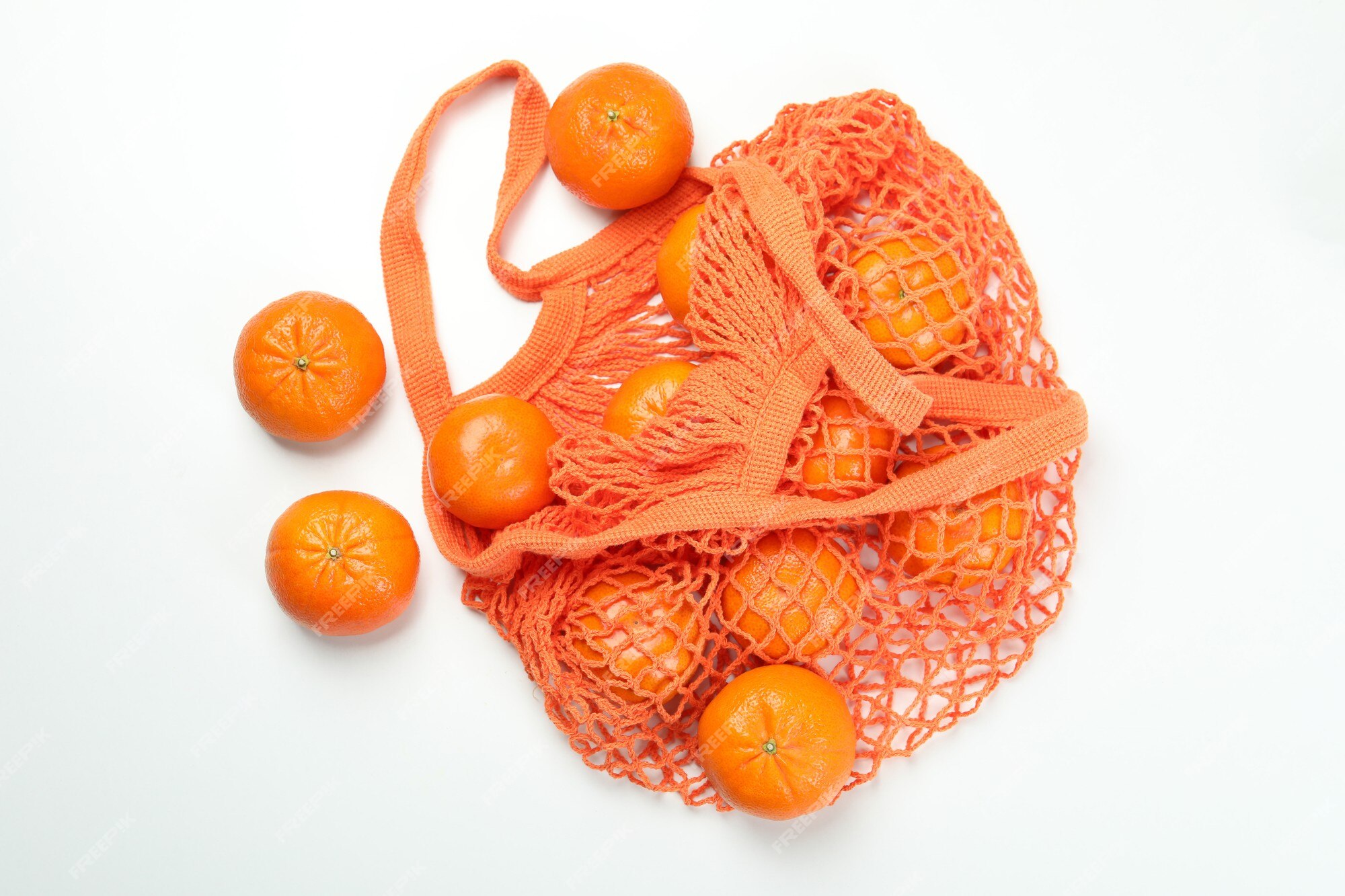 https://img.freepik.com/premium-photo/string-bag-with-mandarins-white-background_185193-55412.jpg?w=2000