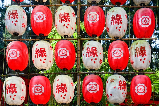 A string of red and white color decorative traditional japanese paper lanterns