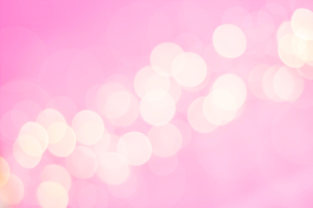 strip of defocused white lights on pink background