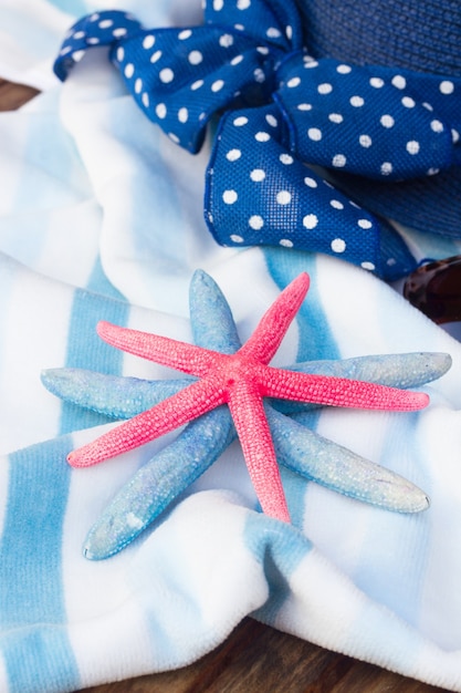 Striped  beach towel, starfish   and sun hat