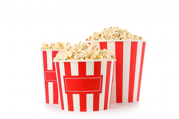 Striped buckets with popcorn isolated on white background