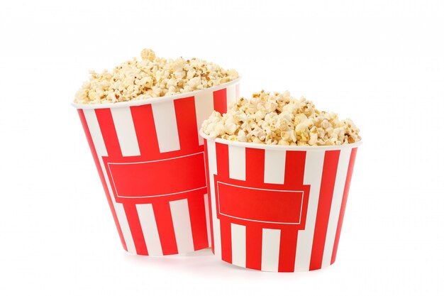 Striped buckets with popcorn isolated on white background