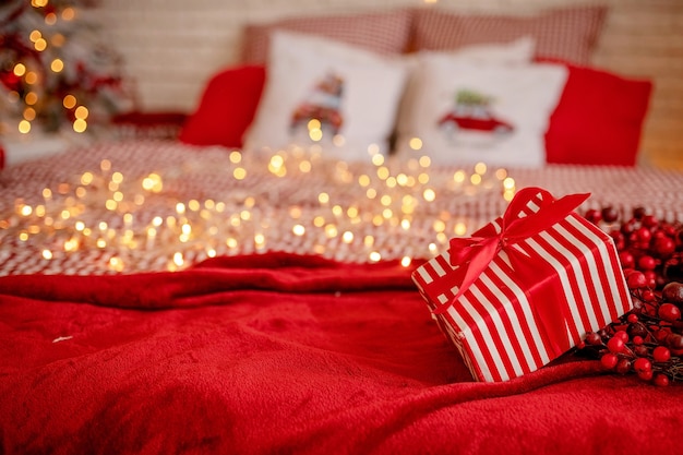 striped gift box on bed