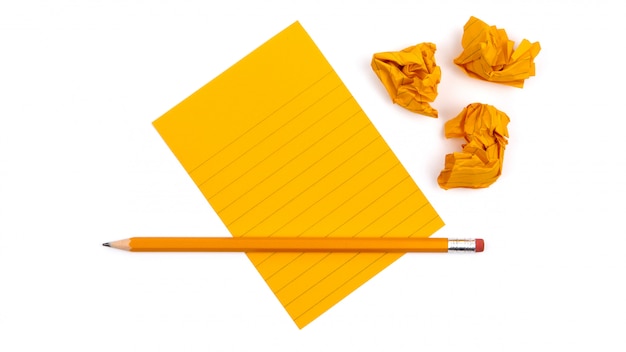 A striped notebook with orange sheets 