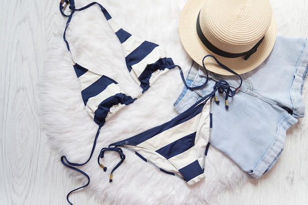 Striped swimsuit, straw hat, shorts