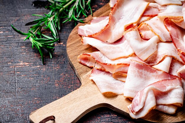 Strips of bacon on a cutting board