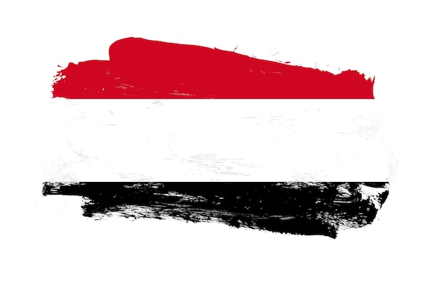 Stroke brush painted distressed flag of yemen on white background