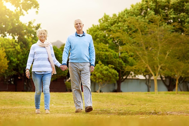 Strolling through the park Portrait of a senior couple enjoying a walk together in a park