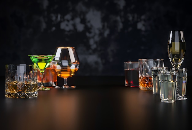 Strong alcoholic drinks on dark background