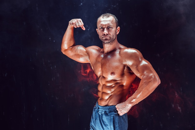 Strong bald bodybuilder with six pack