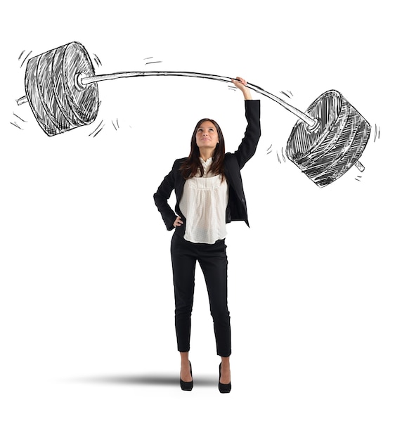 Strong businesswoman holding barbell con dumbells