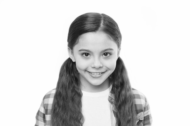 Strong hair concept Kid girl long healthy shiny hair Little girl grow long hair Healthy hair care habits Kid happy smiling cheerful face with adorable hairstyle white background isolated