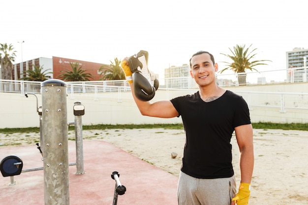 Strong handsome young sportsman boxer