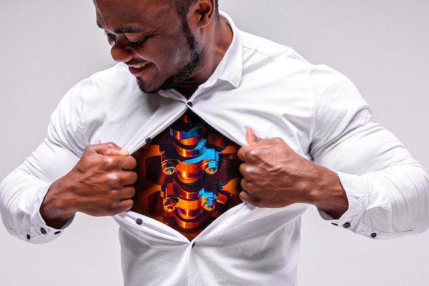 Strong male african businessman rips his shirt. mechanism is\
visible under the shirt