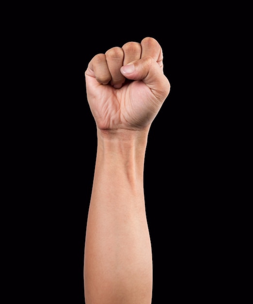 Strong male man raised fist on black background