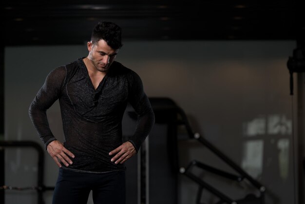 Strong Man in Black Tshirt Background Gym