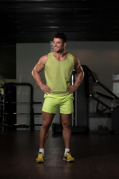 Strong Man in Green Tshirt Background Gym