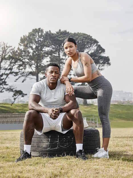 A strong man needs a strong woman by his side Shot of an athletic man and woman posing together outside