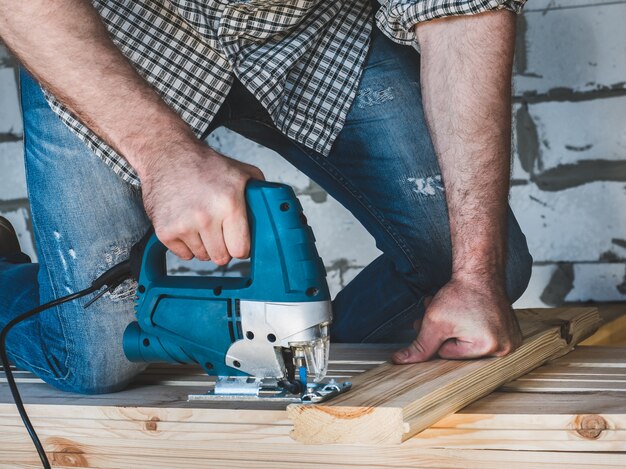 Strong men's hands and tools