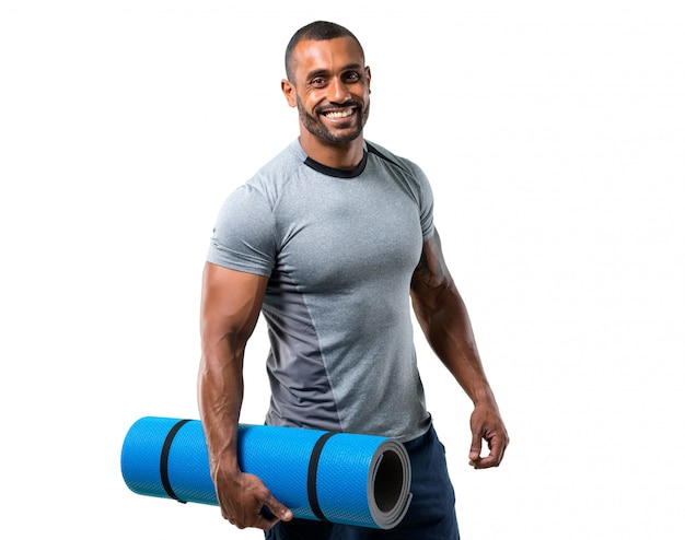 Strong sport man with mat on isolated white background