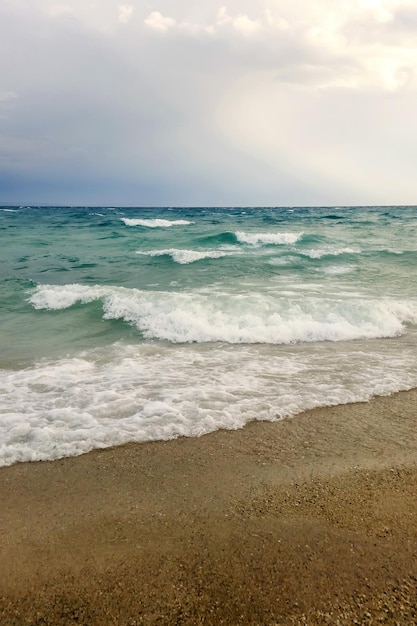 Strong waves crash over the beach beautiful seascape