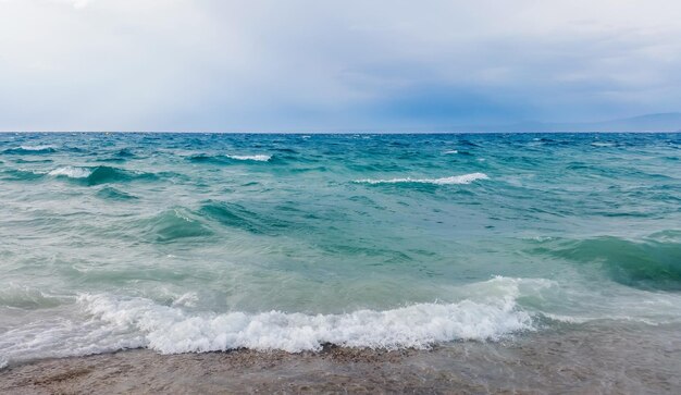 Strong waves crash over the beach Beautiful seascape