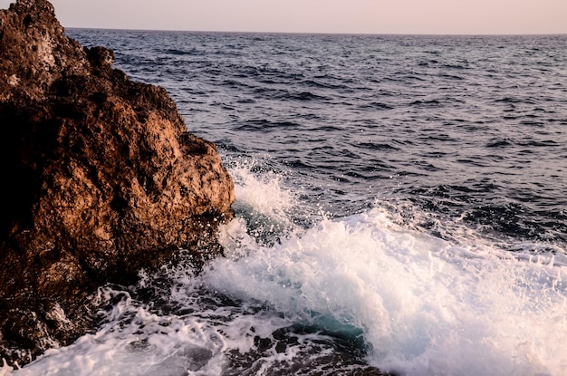 Strong Waves Crashing on the Volcanic Coast