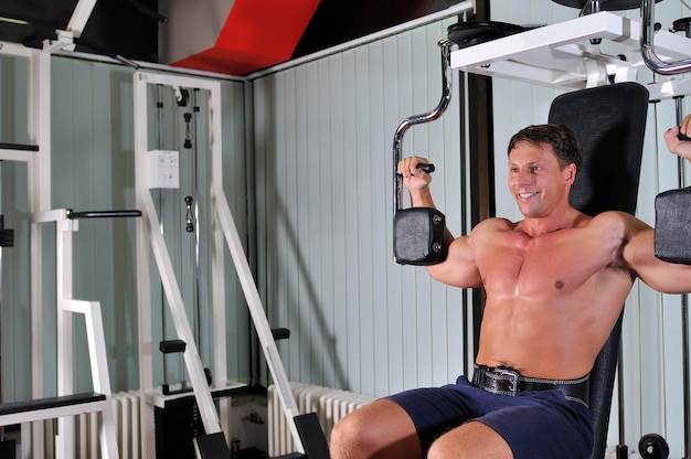 Strong young man work out in gym