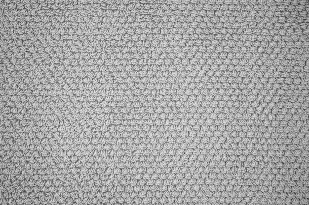 Structure of gray terry fabric. Terry cloth close up photo.