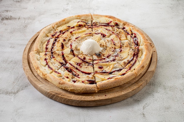 Strudel pizza with apples and ice cream Flat lay