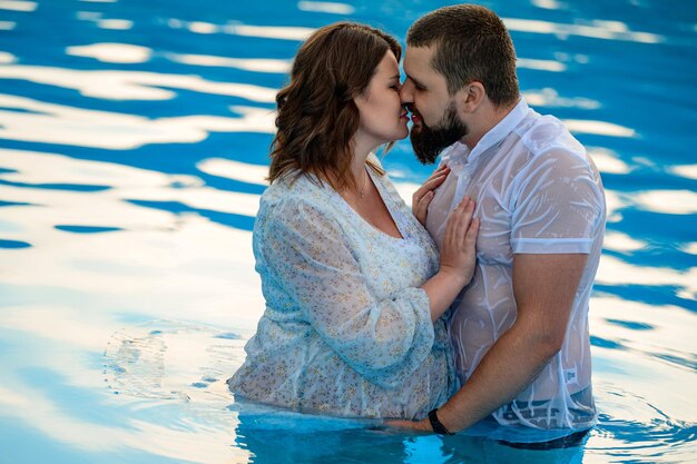 Stryi Ukraine August 12 2021 a pregnant woman and her husband swim in the pool