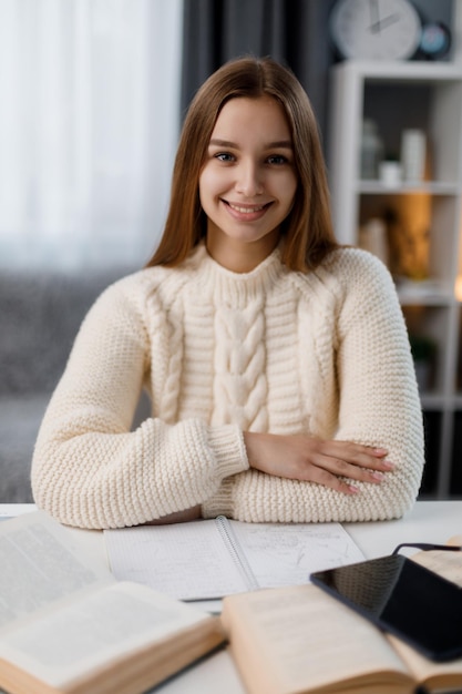 Student at desk with books