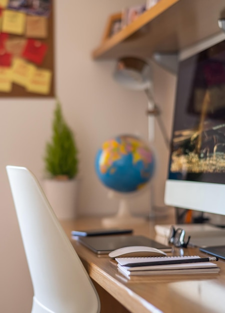 Student Desk With Electronic Devices And Study Supplies In The Interior Of The House