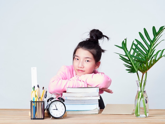 Student girl smiling sitting at desk.