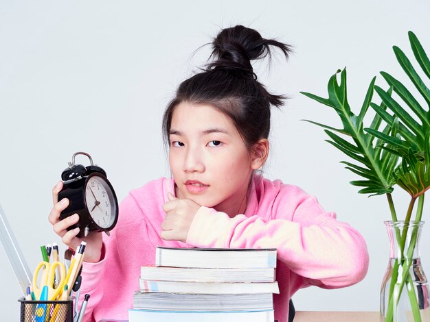 Student girl smiling sitting at desk.