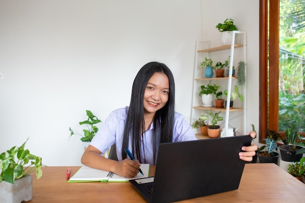 Student girl study by slfe on laptop in room