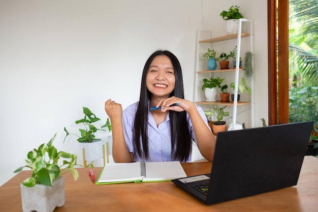 Student girl study by slfe on laptop in room